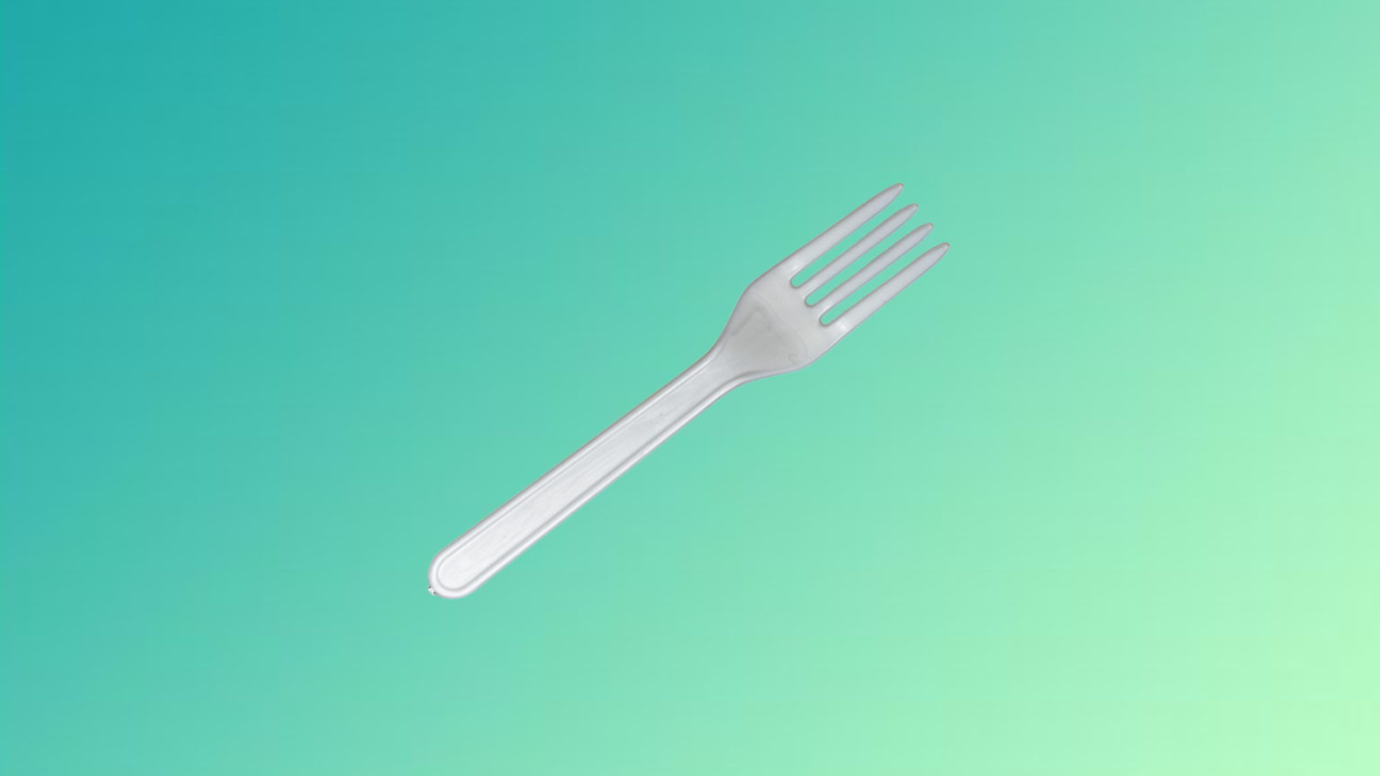 white compostable fork with a green gradient background